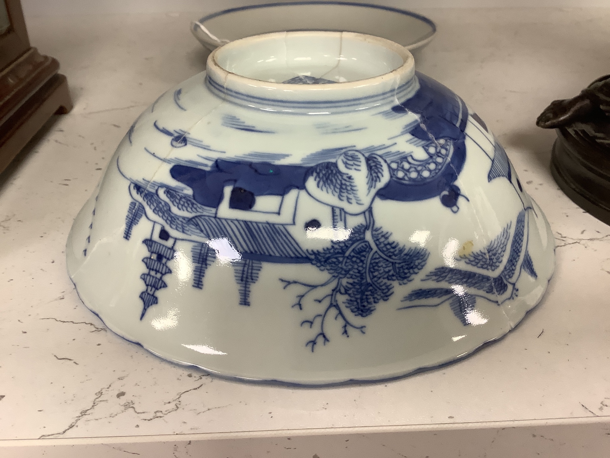 A Chinese blue and white landscape bowl, a/f and a Chinese blue and white ‘dragon’ dish, 18 and 16.5 cm